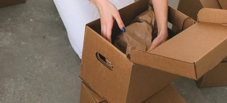 A woman packing a box