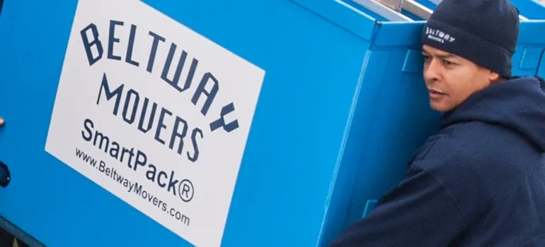 A mover holding a box